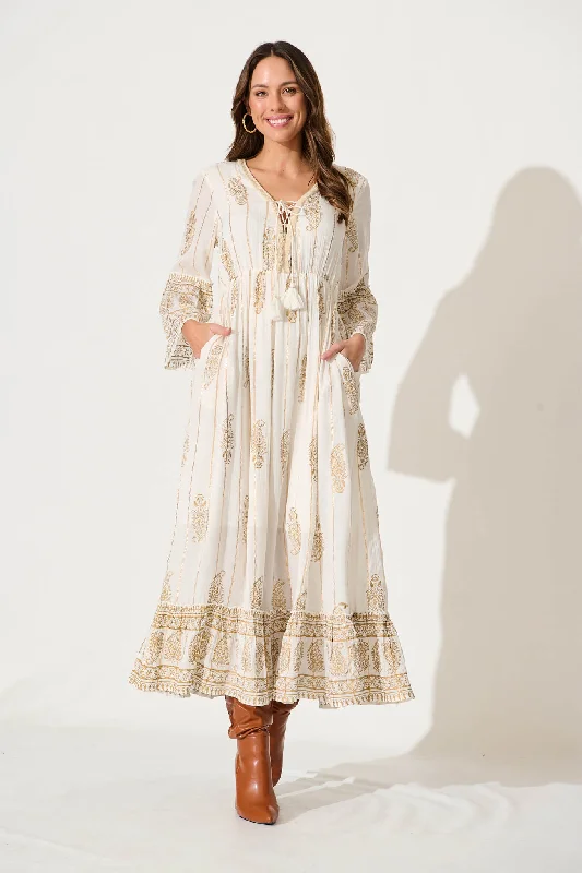 Party Dresses with Sheer Panels and Beaded Trim and Embroidered Paisley Patterns for Ladies' Sultry and Exotic LookEllie Maxi Dress In White With Gold Print Party Dresses with Sheer Panels and Beaded Trim and Embroidered Paisley Patterns for Ladies' Sultry and Exotic LookEllie Maxi Dress In White With Gold Print