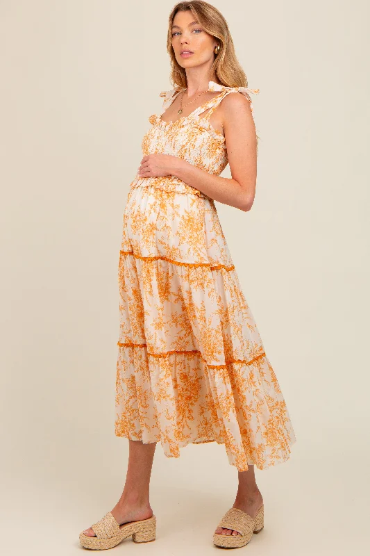 Vintage - inspired 50s midi dress with a classic silhouettePeach Floral Sleeveless Ruffle Tiered Maternity Midi Dress