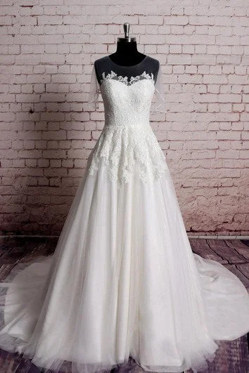 Wedding Dresses with Cut Out Details and Lace Insertions for a Bold and Feminine LookA-Line Lace and Tulle Dress With Jewel Neck and Illusion Short Sleeves Wedding Dresses with Cut Out Details and Lace Insertions for a Bold and Feminine LookA-Line Lace and Tulle Dress With Jewel Neck and Illusion Short Sleeves