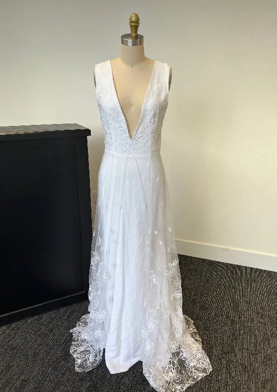 Wedding Dresses with Beaded Floral Wreath on the Bodice and Tulle Skirt and High Neck for a Delicate and Festive LookBalanchine Rime Arodaky Wedding Dresses with Beaded Floral Wreath on the Bodice and Tulle Skirt and High Neck for a Delicate and Festive LookBalanchine Rime Arodaky