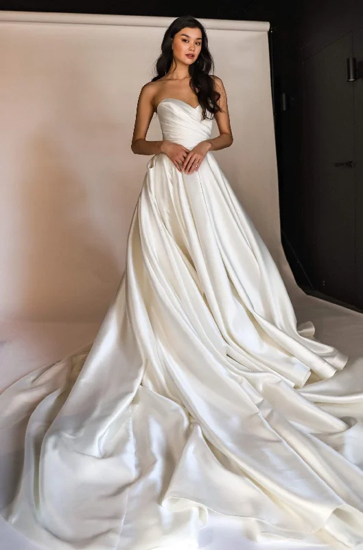 Wedding Dresses with Sequined Stripes and Sheer Back and Embroidered Birds and Belt for a Bold and Nature Inspired LookClassic Mikado Wedding Dress Gloria with Detachable Huge Bow Wedding Dresses with Sequined Stripes and Sheer Back and Embroidered Birds and Belt for a Bold and Nature Inspired LookClassic Mikado Wedding Dress Gloria with Detachable Huge Bow