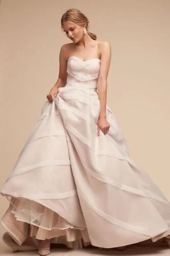 Wedding Dresses with Lace and Tulle Combo and Bow Accents and Beaded Bodice for a Fairy Tale LookBHLDN Whispers & Echoes Carlton Gown Wedding Dresses with Lace and Tulle Combo and Bow Accents and Beaded Bodice for a Fairy Tale LookBHLDN Whispers & Echoes Carlton Gown