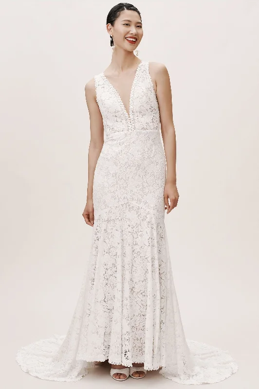 Wedding Dresses with Sheer Sleeve and Sequined Cuffs and Bow at the Waist and Embroidered Skirt and Belt for an Elegant and Intricate LookBHLDN Whispers & Echoes Latimer Gown Wedding Dresses with Sheer Sleeve and Sequined Cuffs and Bow at the Waist and Embroidered Skirt and Belt for an Elegant and Intricate LookBHLDN Whispers & Echoes Latimer Gown