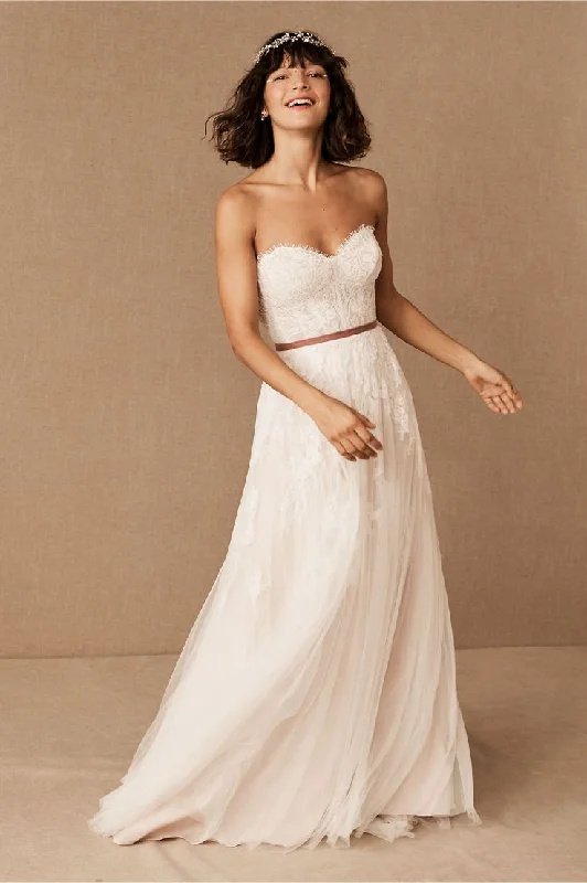 Wedding Dresses with Ruffled Sleeves and High Neck and Belt for a Dramatic and Elegant LookBHLDN Willowby Geranium Gown Wedding Dresses with Ruffled Sleeves and High Neck and Belt for a Dramatic and Elegant LookBHLDN Willowby Geranium Gown