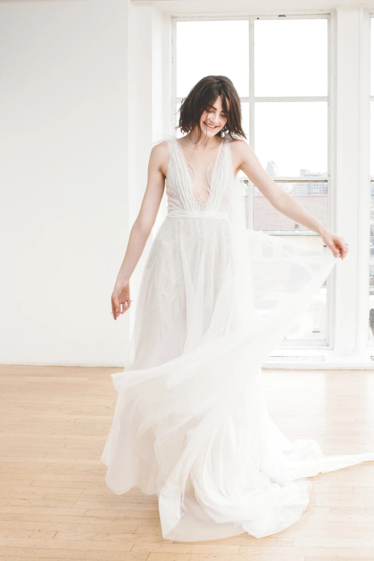 Wedding Dresses with Satin Trimmed Collar and Ruffled Hem and Bow at the Waist for a Classic and Girly LookInes Di Santo Alyne