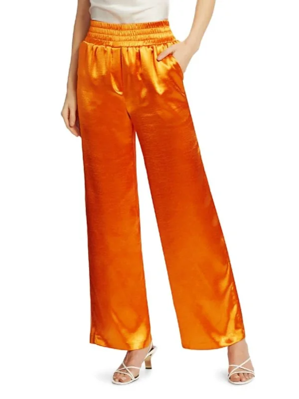 Trousers with side slits for women in a modern designKylie Pant In Citrus Orange