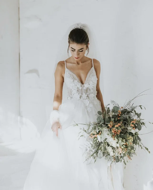 Wedding Dresses with Sequined Dots and Sheer Skirt for a Playful and Sultry LookLovely Handmade Flowers V-neck Tulle Backless Wedding Dresses Wedding Dresses with Sequined Dots and Sheer Skirt for a Playful and Sultry LookLovely Handmade Flowers V-neck Tulle Backless Wedding Dresses