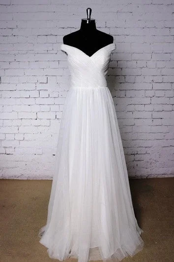 Wedding Dresses with Cut Out Details and Lace Insertions for a Bold and Feminine LookOff-The-Shoulder V-Neck A-Line Pleated Tulle Dress With Crisscross Bodice Wedding Dresses with Cut Out Details and Lace Insertions for a Bold and Feminine LookOff-The-Shoulder V-Neck A-Line Pleated Tulle Dress With Crisscross Bodice