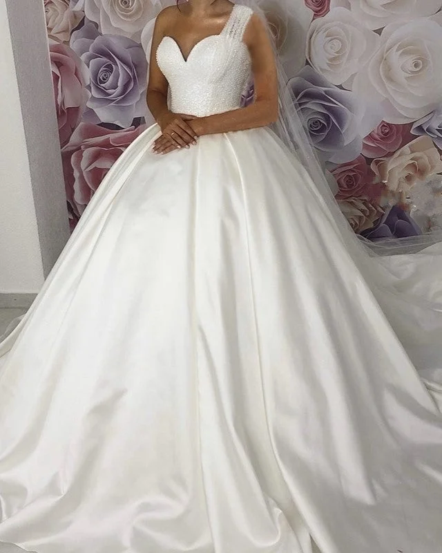 Wedding Dresses with Ruffled Sleeveless Top and Sequined Bodice and Tulle Skirt and Beaded Waistband and Bow at the Back and Embroidered Floral Patterns for a Dramatic and Glamorous LookOne Shoulder Wedding Dresses Ball Gown Sequins Sweetheart Wedding Dresses with Ruffled Sleeveless Top and Sequined Bodice and Tulle Skirt and Beaded Waistband and Bow at the Back and Embroidered Floral Patterns for a Dramatic and Glamorous LookOne Shoulder Wedding Dresses Ball Gown Sequins Sweetheart