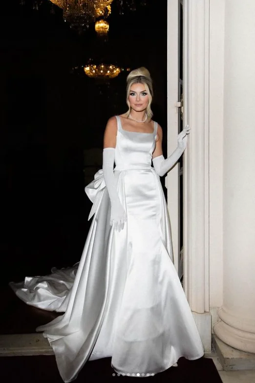 Wedding Dresses with Cut Out Details and Lace Insertions for a Bold and Feminine LookSquare Neck Princess Wedding Gown with Bow Train Wedding Dresses with Cut Out Details and Lace Insertions for a Bold and Feminine LookSquare Neck Princess Wedding Gown with Bow Train