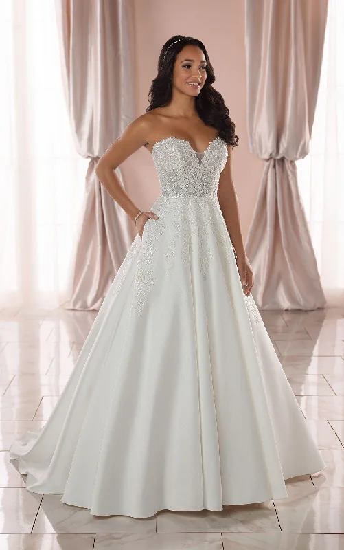 Wedding Dresses with Lace Insertions on the Skirt and Beaded Waistband and Ruffled Hem and Bow at the Waist and Embroidered Floral Patterns for a Feminine and Flirty Look6915 Wedding Dresses with Lace Insertions on the Skirt and Beaded Waistband and Ruffled Hem and Bow at the Waist and Embroidered Floral Patterns for a Feminine and Flirty Look6915